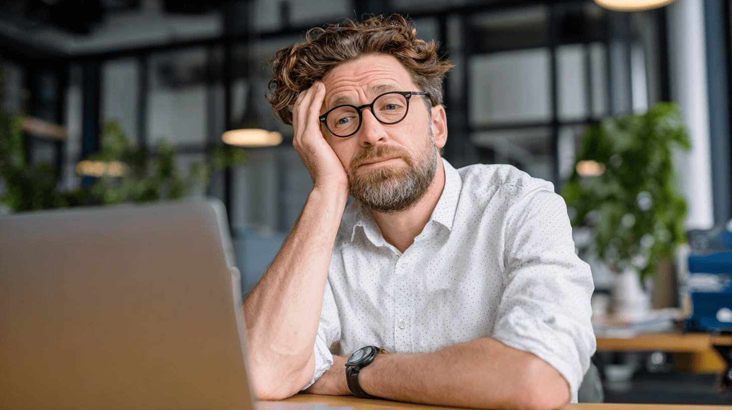 a solopreneur confused at his laptop